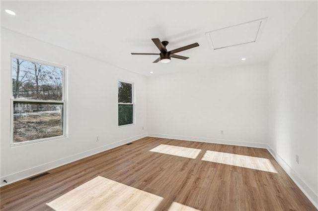 empty room with wood-type flooring and ceiling fan