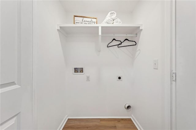 clothes washing area featuring hookup for a washing machine, hardwood / wood-style flooring, and hookup for an electric dryer