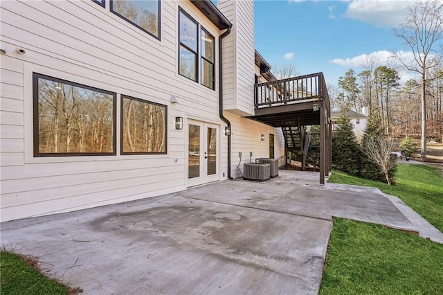 view of patio / terrace featuring a wooden deck and french doors