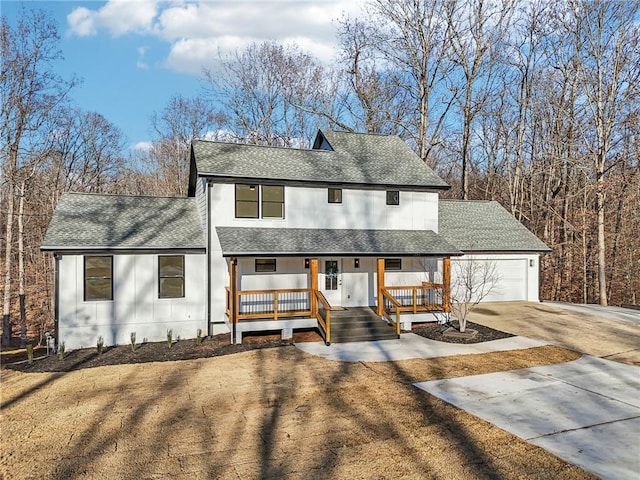 modern farmhouse style home featuring a garage and a porch