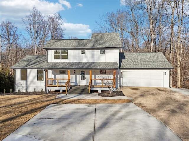 view of front facade with a porch and a garage