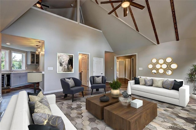 living room with ceiling fan with notable chandelier, high vaulted ceiling, and wine cooler