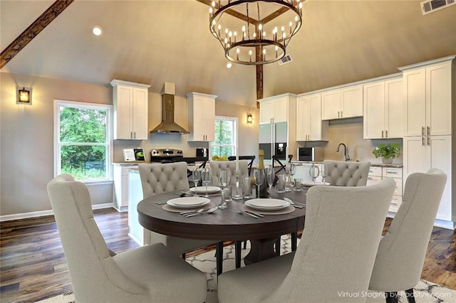 dining area featuring dark wood-type flooring, high vaulted ceiling, beam ceiling, and a chandelier