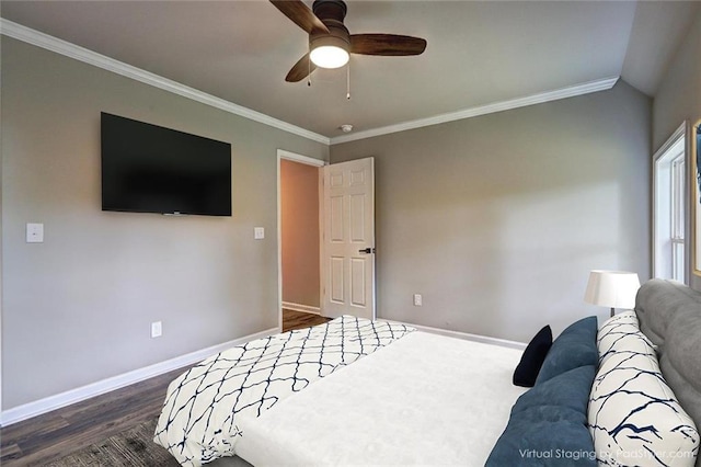 bedroom with vaulted ceiling, ceiling fan, crown molding, and dark hardwood / wood-style floors