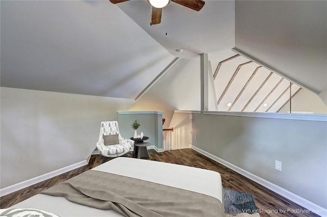 bedroom with ceiling fan, vaulted ceiling, and dark hardwood / wood-style floors