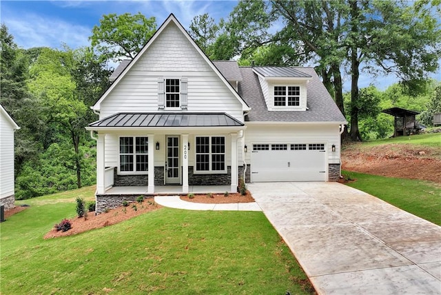 200 College Ave, Commerce, GA 30529 - modern farmhouse with a porch, a standing seam roof, stone siding, a front yard, and concrete driveway