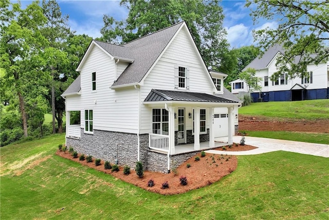 200 College Ave, Commerce, GA 30529 - rear view of house with a porch, a garage, a yard, stone siding, and driveway
