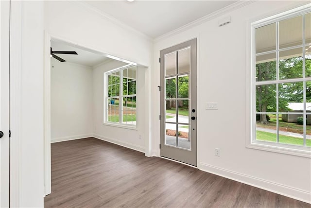 200 College Ave, Commerce, GA 30529 - doorway to outside with dark wood-type flooring, a ceiling fan, crown molding, and baseboards
