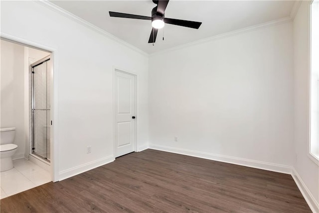 200 College Ave, Commerce, GA 30529 - unfurnished bedroom featuring wood finished floors, ornamental molding, baseboards, ensuite bath, and ceiling fan