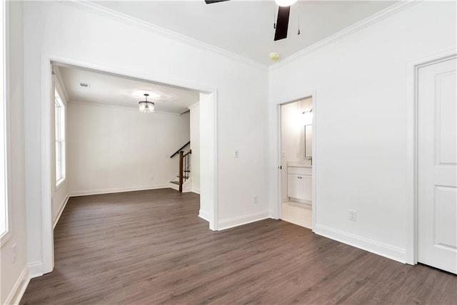 200 College Ave, Commerce, GA 30529 - spare room featuring stairs, dark wood finished floors, crown molding, a ceiling fan, and baseboards