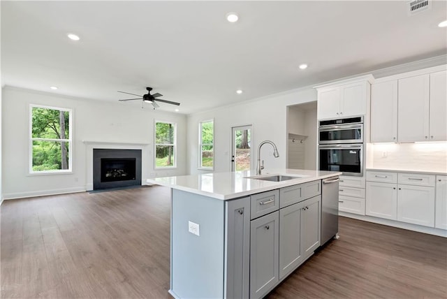 200 College Ave, Commerce, GA 30529 - kitchen with a sink, stainless steel appliances, a ceiling fan, plenty of natural light, and recessed lighting