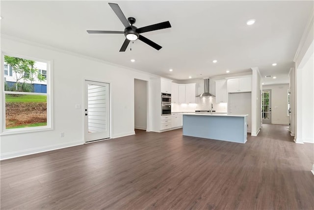 200 College Ave, Commerce, GA 30529 - unfurnished living room featuring dark wood-style floors, recessed lighting, a ceiling fan, crown molding, and baseboards