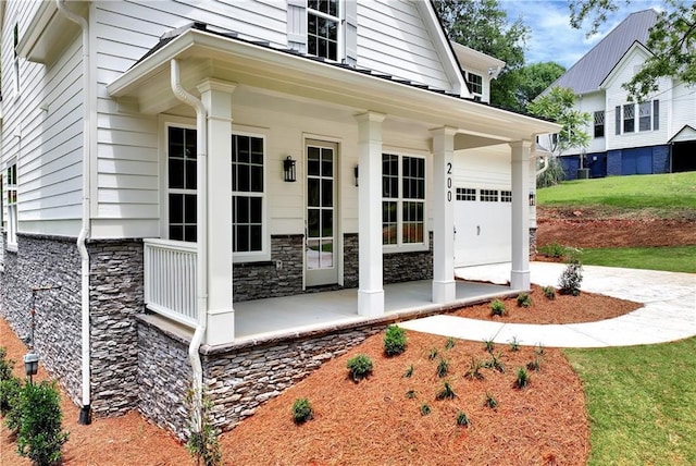 200 College Ave, Commerce, GA 30529 - entrance to property with a porch, stone siding, and an attached garage