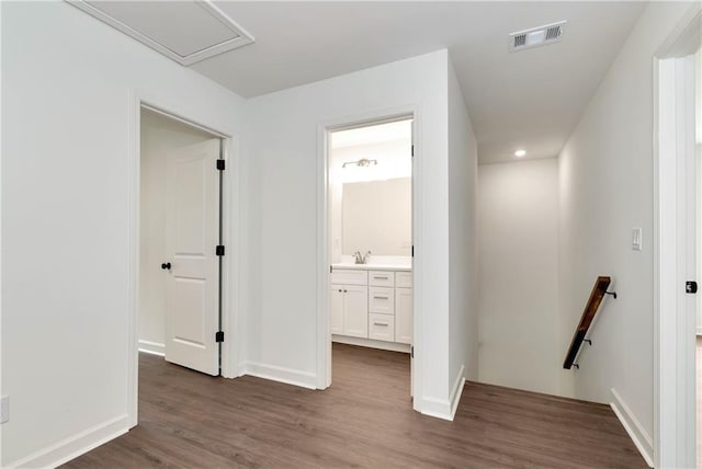 200 College Ave, Commerce, GA 30529 - corridor featuring an upstairs landing, wood finished floors, a sink, baseboards, and recessed lighting