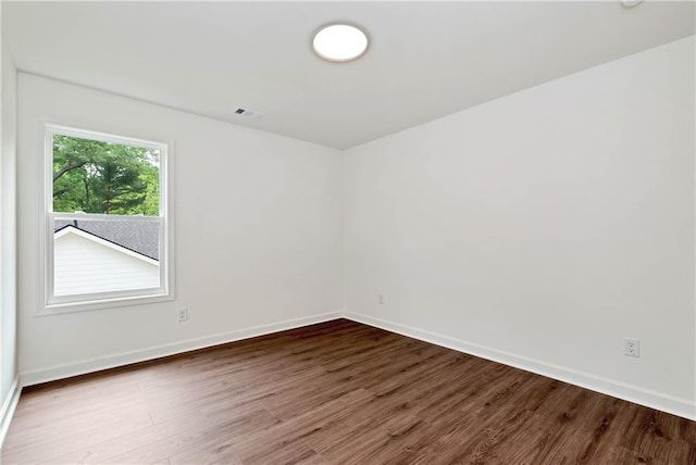 200 College Ave, Commerce, GA 30529 - empty room featuring dark wood-style floors and baseboards