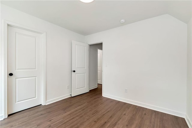 200 College Ave, Commerce, GA 30529 - unfurnished bedroom with wood finished floors and baseboards