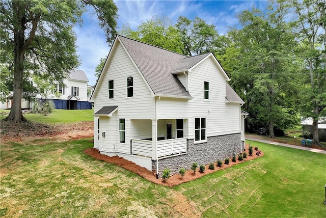 200 College Ave, Commerce, GA 30529 - view of front facade featuring roof with shingles and a front lawn