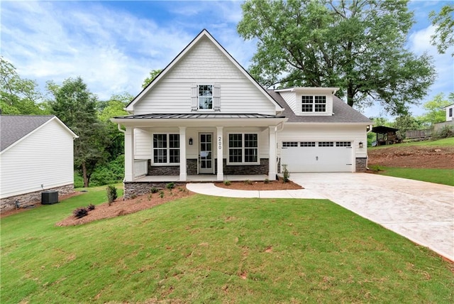 200 College Ave, Commerce, GA 30529 - modern farmhouse style home featuring stone siding, driveway, central AC, a standing seam roof, and an attached garage