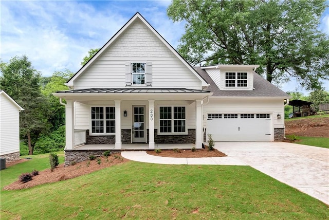 200 College Ave, Commerce, GA 30529 - view of front of home with stone siding, a porch, a garage, concrete driveway, and a standing seam roof