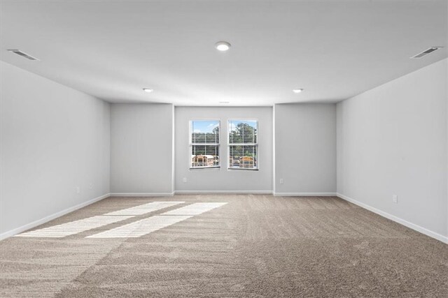 empty room featuring light colored carpet