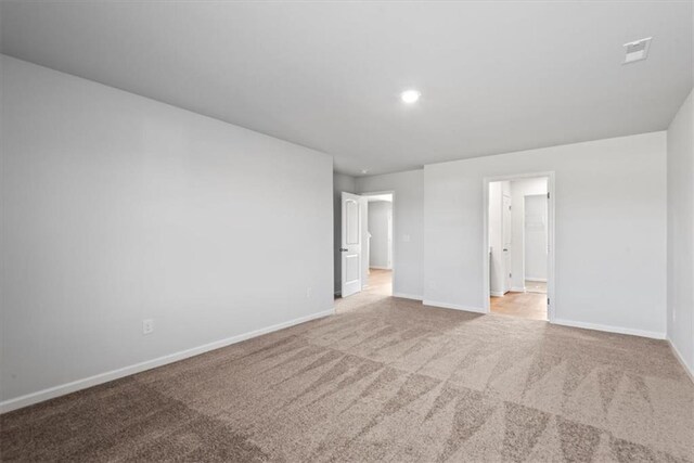 unfurnished room with light hardwood / wood-style floors