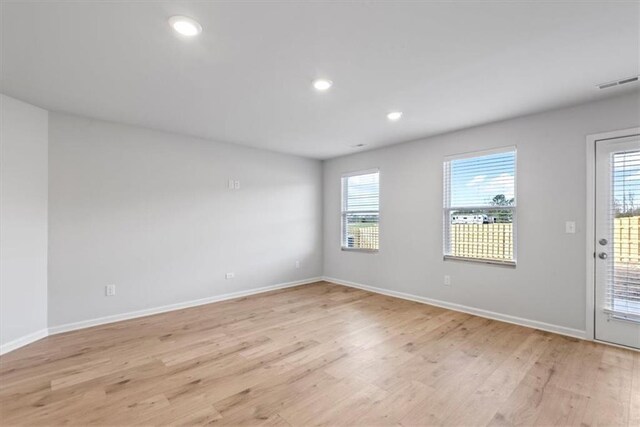 unfurnished bedroom featuring light colored carpet and a closet