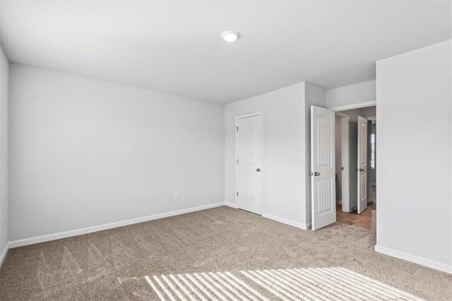 clothes washing area with light hardwood / wood-style floors and electric dryer hookup