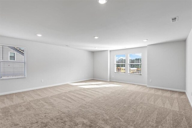 unfurnished bedroom with light colored carpet