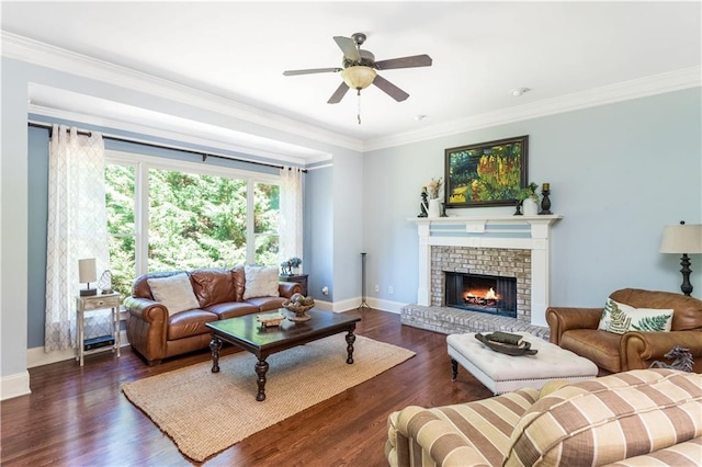 living room featuring dark hardwood / wood-style flooring, ornamental molding, and a brick fireplace