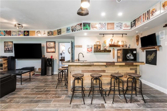 bar featuring sink