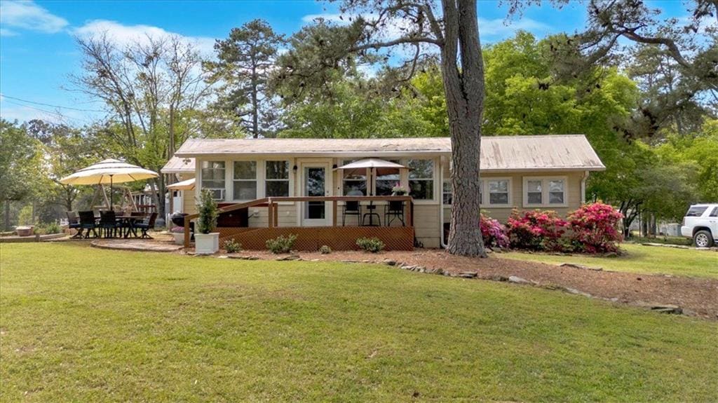 24 Allatoona Landing Rd, Cartersville, GA 30121 - back of house featuring a lawn