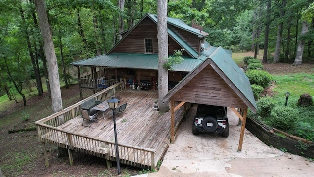 6245 Bannister Rd, Cumming, GA 30028 - exterior space featuring metal roof and outdoor dining space
