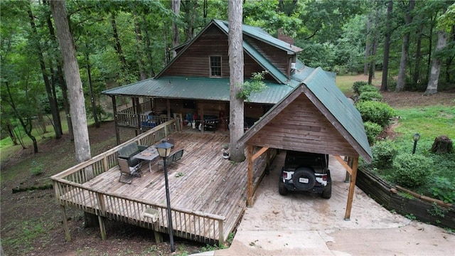 exterior space featuring metal roof and outdoor dining space