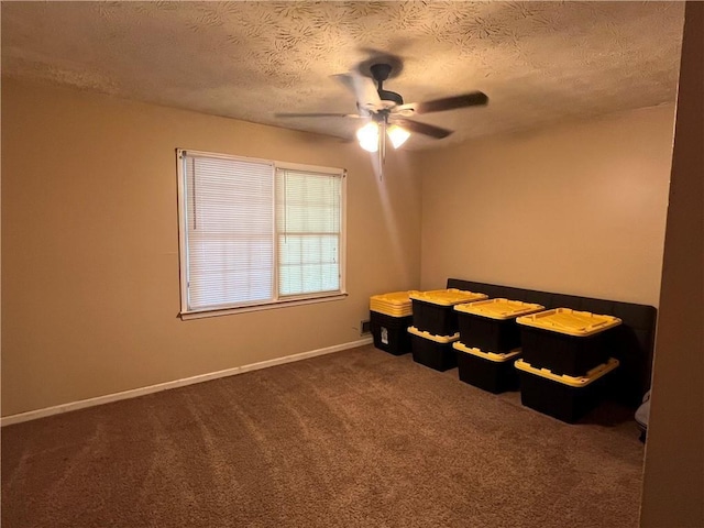 6245 Bannister Rd, Cumming, GA 30028 - bedroom featuring baseboards, a ceiling fan, dark colored carpet, and a textured ceiling