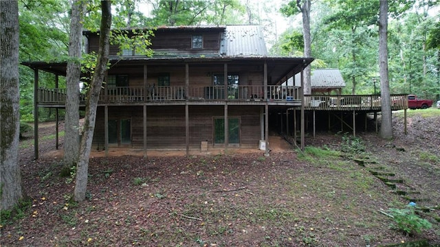 6245 Bannister Rd, Cumming, GA 30028 - back of property with metal roof and a wooden deck