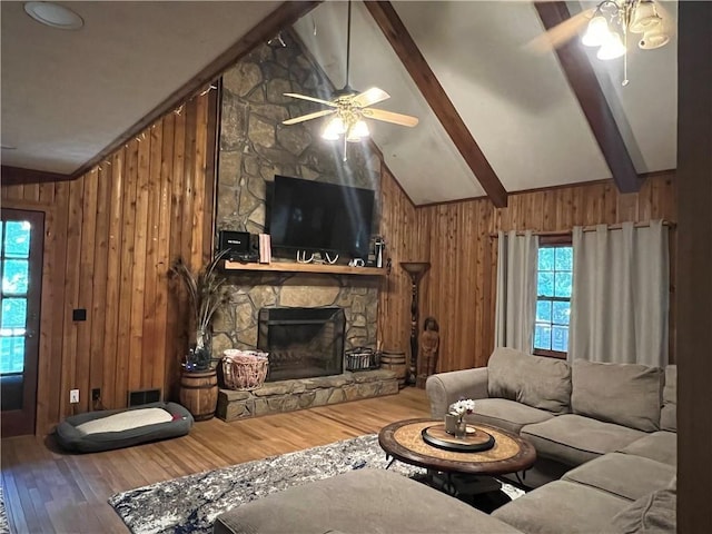 6245 Bannister Rd, Cumming, GA 30028 - living area with beamed ceiling, wood finished floors, a ceiling fan, and wooden walls