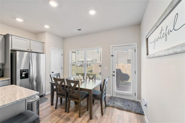 dining room with light hardwood / wood-style floors