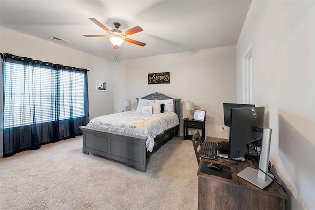 carpeted bedroom with ceiling fan