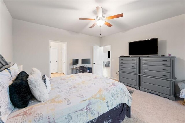 bedroom with light colored carpet and ceiling fan