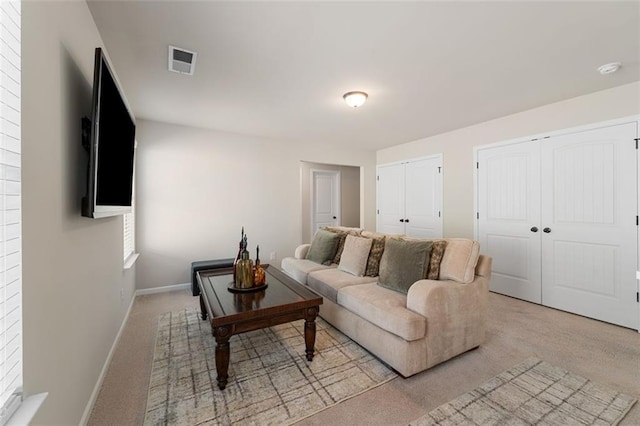 living room featuring light carpet