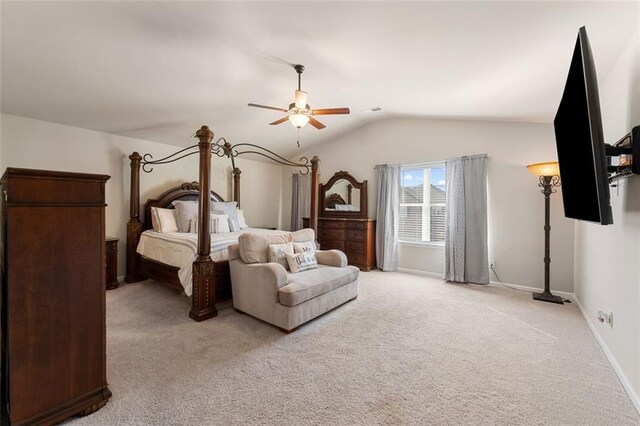 bedroom featuring lofted ceiling, light carpet, and ceiling fan