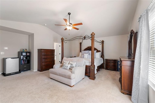 carpeted bedroom featuring ceiling fan and lofted ceiling