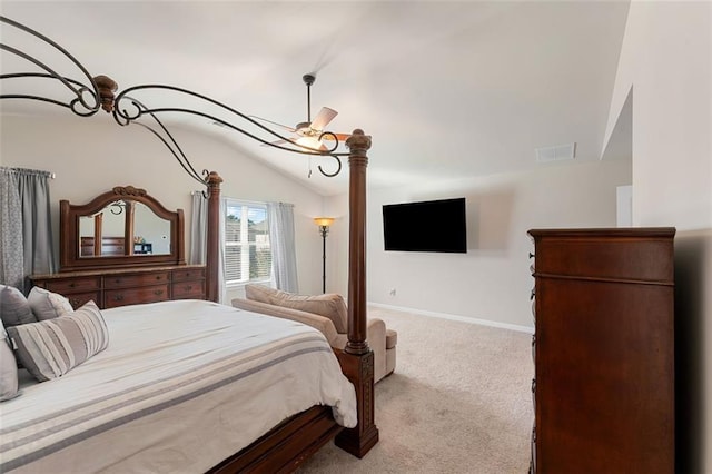 bedroom with vaulted ceiling, light carpet, and ceiling fan