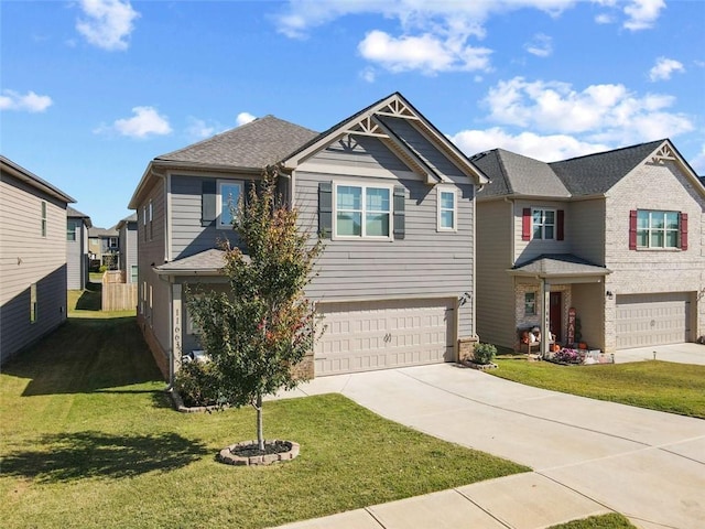 view of front of property featuring a front yard and a garage