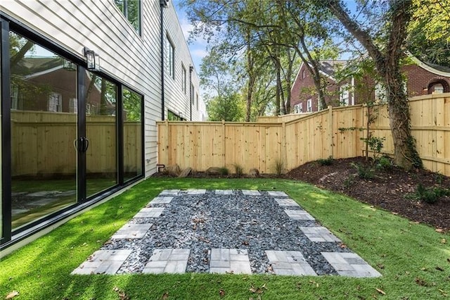 view of yard with a patio and an outdoor fire pit