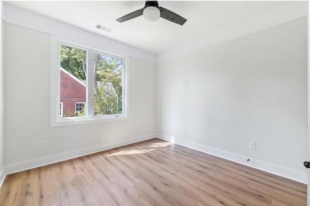 unfurnished room with ceiling fan and light wood-type flooring