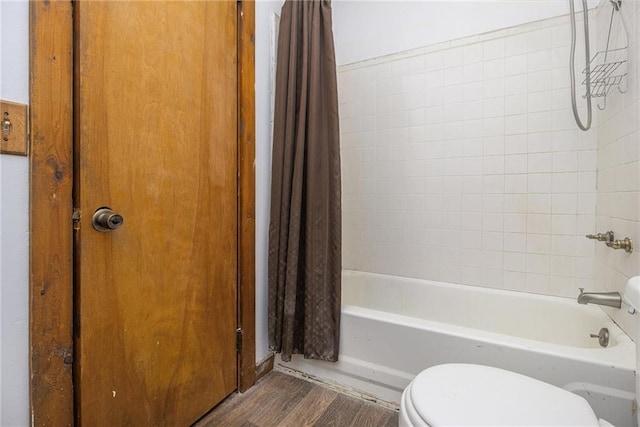 bathroom with shower / bathtub combination with curtain, wood-type flooring, and toilet