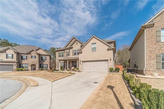 view of front of home with brick siding, concrete driveway, and a garage