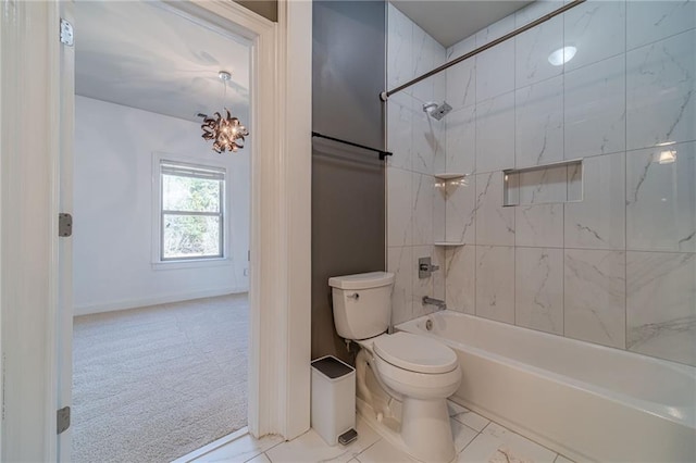 bathroom featuring a chandelier, toilet, shower / bathtub combination, and baseboards