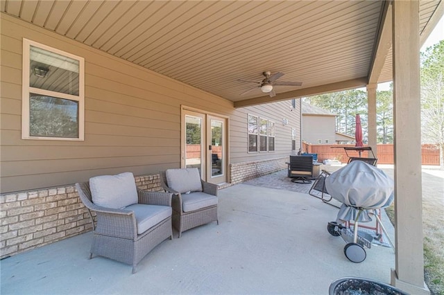 view of patio featuring fence, french doors, and ceiling fan